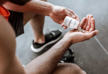 Creatine: Fountain of Youth or Overhyped? Person pouring probiotic pills into their hand