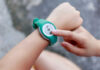 The 10,000 Steps Myth Exposed Person using a fitness tracker on their wrist