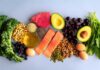 Strawberries’ Surprising Role in Brain Health An assortment of healthy foods including fish, nuts, fruits, and vegetables arranged on a light background