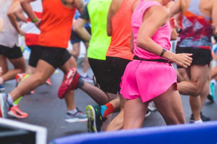 Runners participating in a marathon, wearing colorful athletic gear