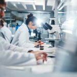 Hidden Silicone Threat Lurks in Every Breath Scientists working in a laboratory with microscopes and test tubes