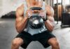 Athlete performing a kettlebell squat in a gym