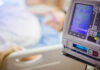 IV pump displaying medication flow rate in a hospital room