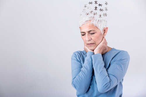 Elderly woman with a unique hairstyle made of puzzle pieces, looking thoughtful