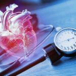 Uuseful tips to help reduce your risk of heart disease An anatomical heart illustration next to a blood pressure monitor