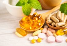 Best Foods and Supplements for your Gut Health Assorted vitamins and supplements arranged with mint leaves