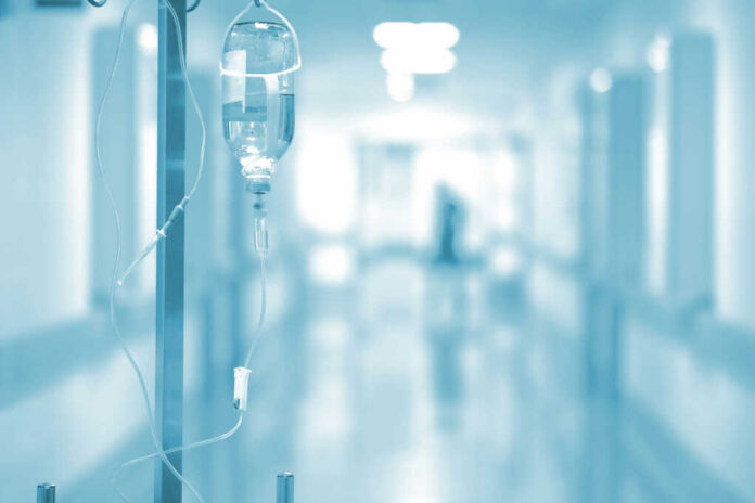 shutterstock_298737923-1 IV drip in a hospital corridor with a blurred background