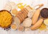 Gluten: A Benefit or Harm to the Body? Assorted grains and breads on a wooden table