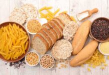 Gluten: A Benefit or Harm to the Body? Assorted grains and breads on a wooden table
