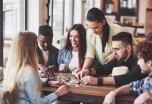 How Late-life social activity affects dementia Group of friends playing a board game at a table