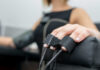 Close-up of a patients hand during a medical examination with monitoring equipment