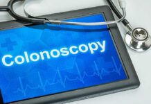 Why Early-Onset Cancer Is On the Rise Tablet displaying the word Colonoscopy with a stethoscope beside it