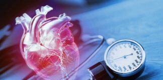 An anatomical heart illustration next to a blood pressure monitor