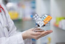 Ozempic Clock-Stopping Twist Stuns Scientists A doctor holding a miniature shopping cart filled with various medication packs