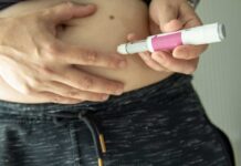 Something Strange Is Happening to Athletes Who Take GLP-1s Person administering an insulin injection to their abdomen