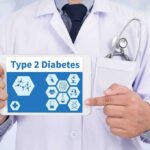 Doctor holding tablet about type 2 diabetes