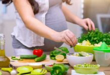Hidden Plant Compounds Upend Cancer Risk Person preparing a fresh salad with green vegetables in a kitchen