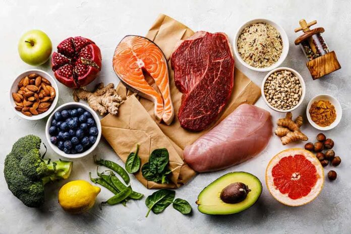 shutterstock_1043901130 Assorted healthy foods with salmon, beef, chicken, fruits, vegetables, nuts, and grains
