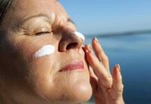 Wrinkle Cure Myth Shattered Woman applying sunscreen near water