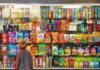 Child looking at a shop window filled with snacks and cereals