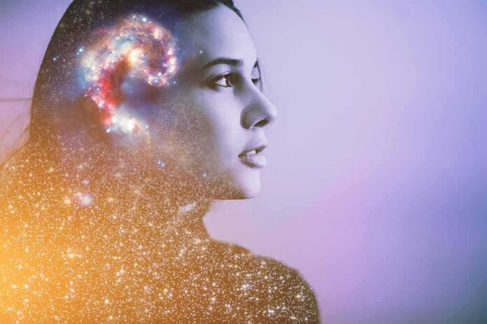 shutterstock_1502881307 woman in profile with galaxy overlay around head