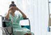 Rising tide of cancer among young adults in the USA Woman in a wheelchair holding her head