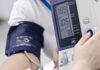 Silent Habits That Slash Blood Pressure Person having blood pressure measured with digital monitor