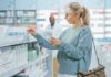 Birth Control Pill Paradox: Hot Flashes Surge? Woman shopping for medicine in a pharmacy aisle