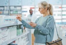 Birth Control Pill Paradox: Hot Flashes Surge? Woman shopping for medicine in a pharmacy aisle