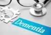 Metabolism Clues That Predict Dementia Risk Stethoscope and brain puzzle piece on desk