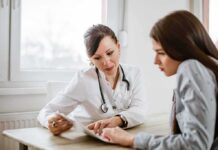 Health Insurance Trick? Why Copays Aren’t So Simple Doctor consulting a patient at a desk