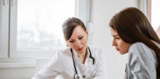 Doctor consulting a patient at a desk
