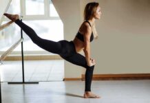 Static vs. Dynamic Stretching for Injury Prevention woman stretching at a ballet barre