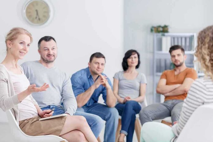 Support group meeting with six adults seated in a circle