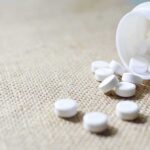 FDA Flags Deadly Twist In Popular Diabetes Pills White tablets spilling from a plastic bottle