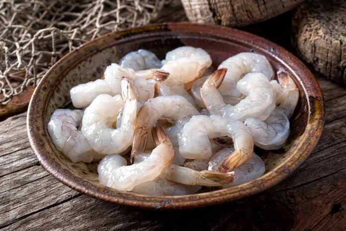Raw shrimp in a rustic bowl