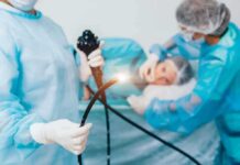 Leukemia Drug Flips Stomach Cancer Rules Medical staff preparing endoscope near patient on hospital bed