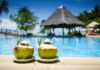 Kidney Nurse’s Coconut Water Warning Two coconut drinks with straws beside a swimming pool