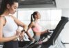 Apple’s One-Number Fitness Gamble Woman on treadmill checking smartwatch in gym