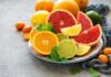 Assorted citrus slices on a plate with mint leaves