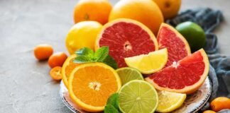 Assorted citrus slices on a plate with mint leaves