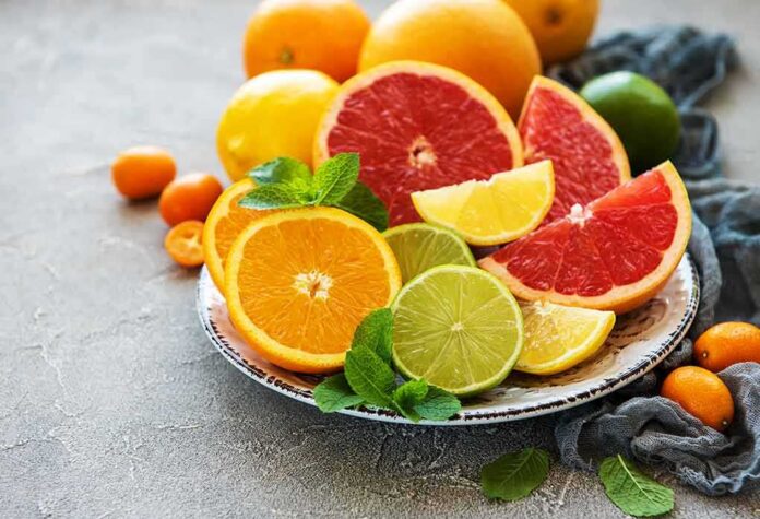 shutterstock_1415401322 Assorted citrus slices on a plate with mint leaves