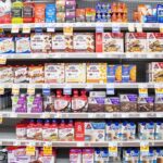 Sugar-Free Protein Bites: Full or Fooled? Grocery aisle shelves with protein bars and shakes