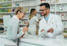 Pharmacist assists customer at pharmacy counter