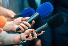 Cancer Flagged Additive Hides In Bread Reporters holding colorful microphones