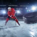 Ignored Concussions, Permanent Consequences Hockey player in red skates toward a flying puck