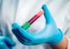 Silent Blood Clue That Flags Heart Danger Gloved hand holding a blood sample tube
