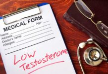 medical form on clipboard with stethoscope and glasses