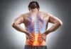 Back Pain’s Silent Fix Exposed Man holding lower back with highlighted spine illustration