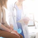 Doctor consulting with patient in clinic